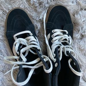 Black and gum soled Vans